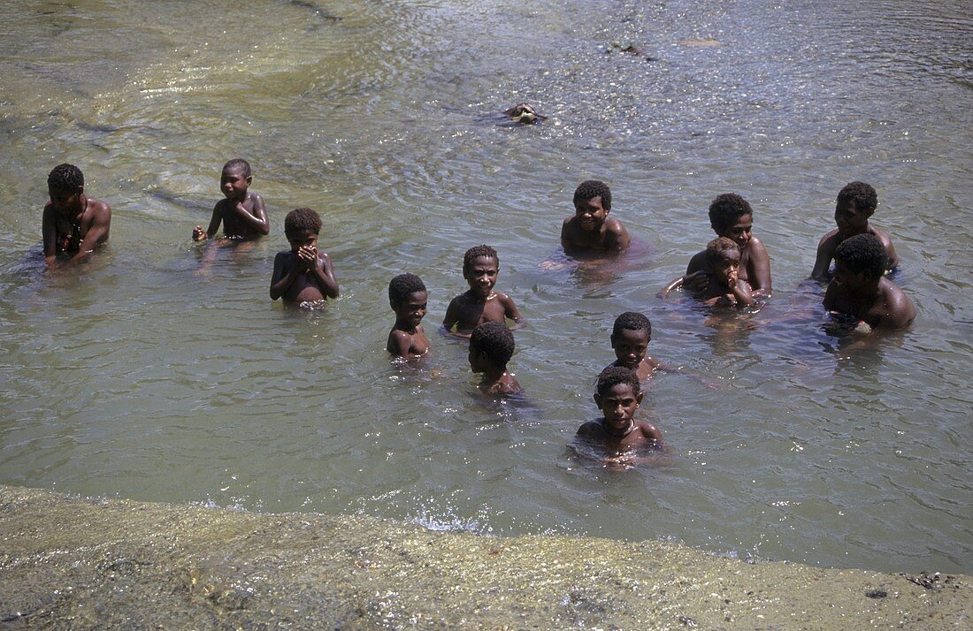 Bathing in a river,Papua New Guinea