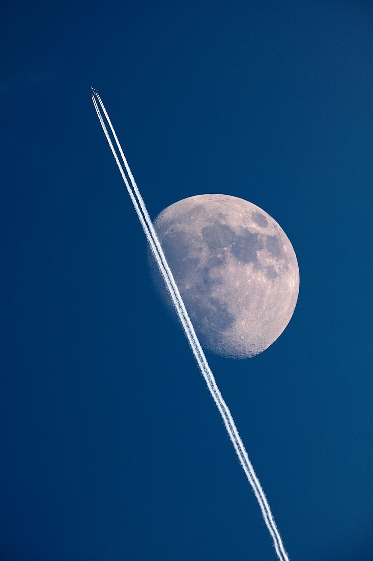 Moon and aircraft contrails