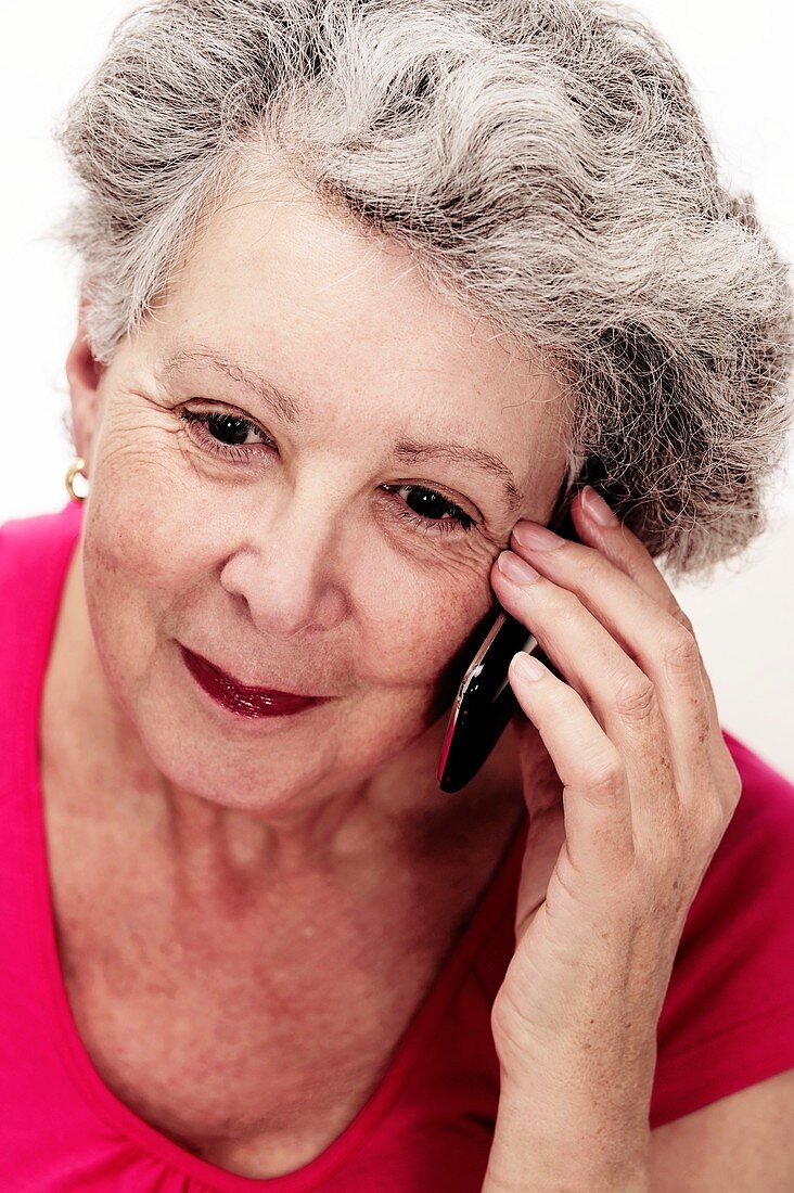 Elderly woman using a mobile phone