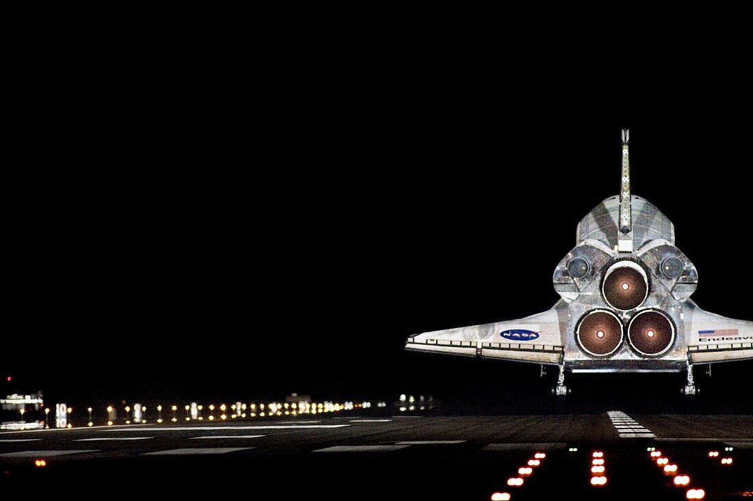 Space shuttle landing at night