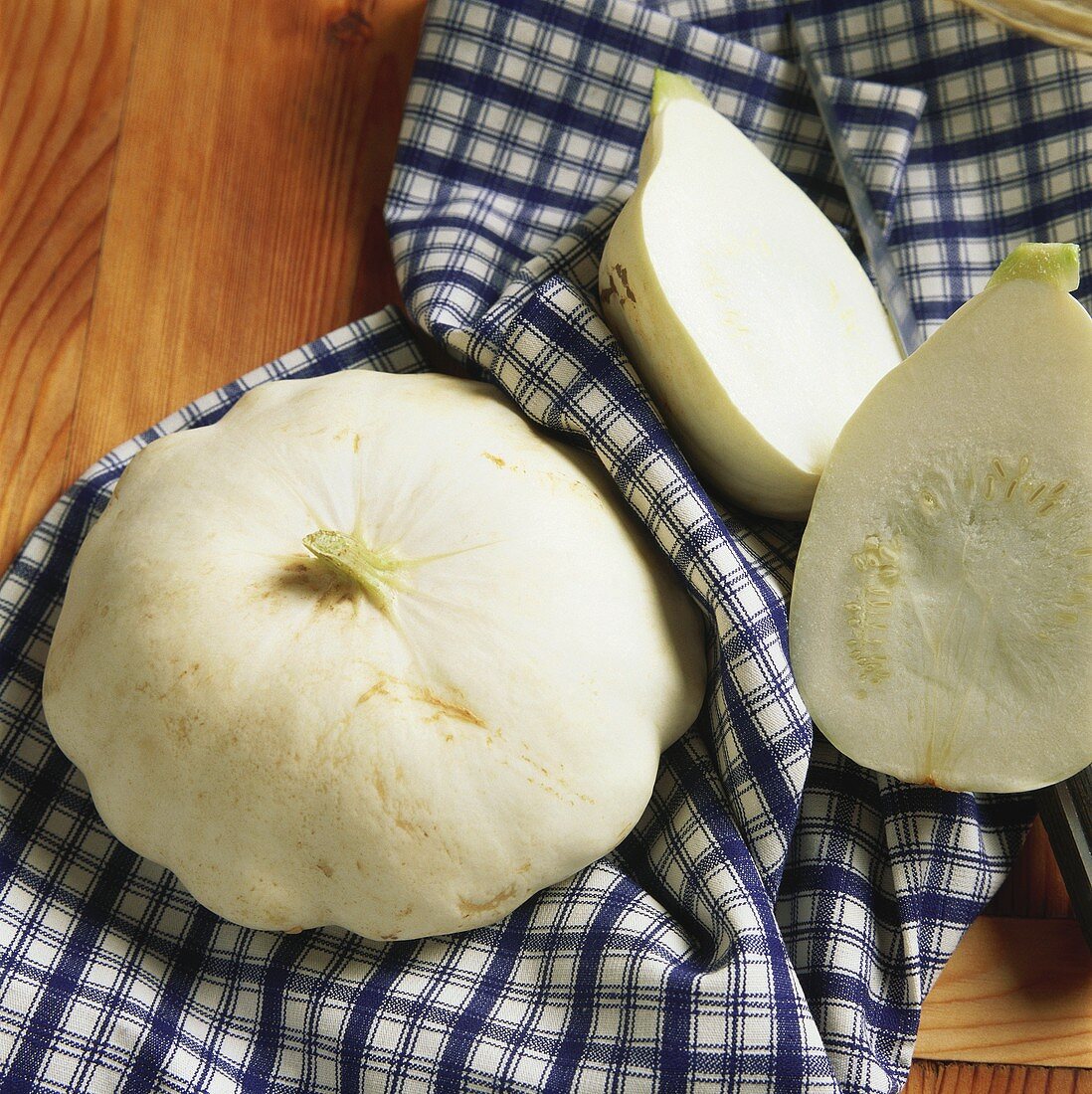 Two White Pumpkins on a Dish Towel