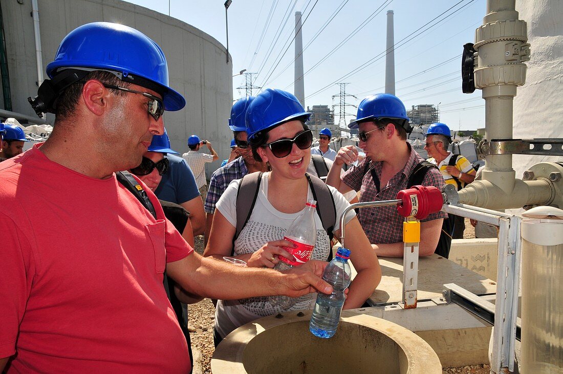 Visitors taste desalinated water