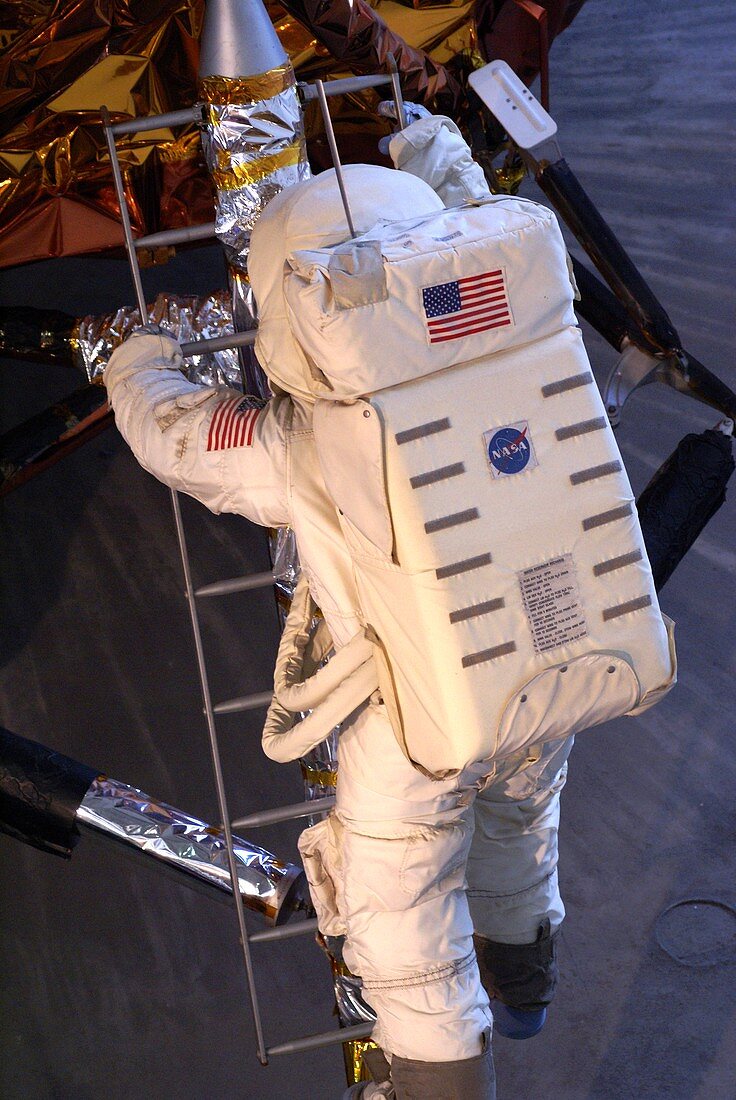 Astronaut descending Lunar Module ladder