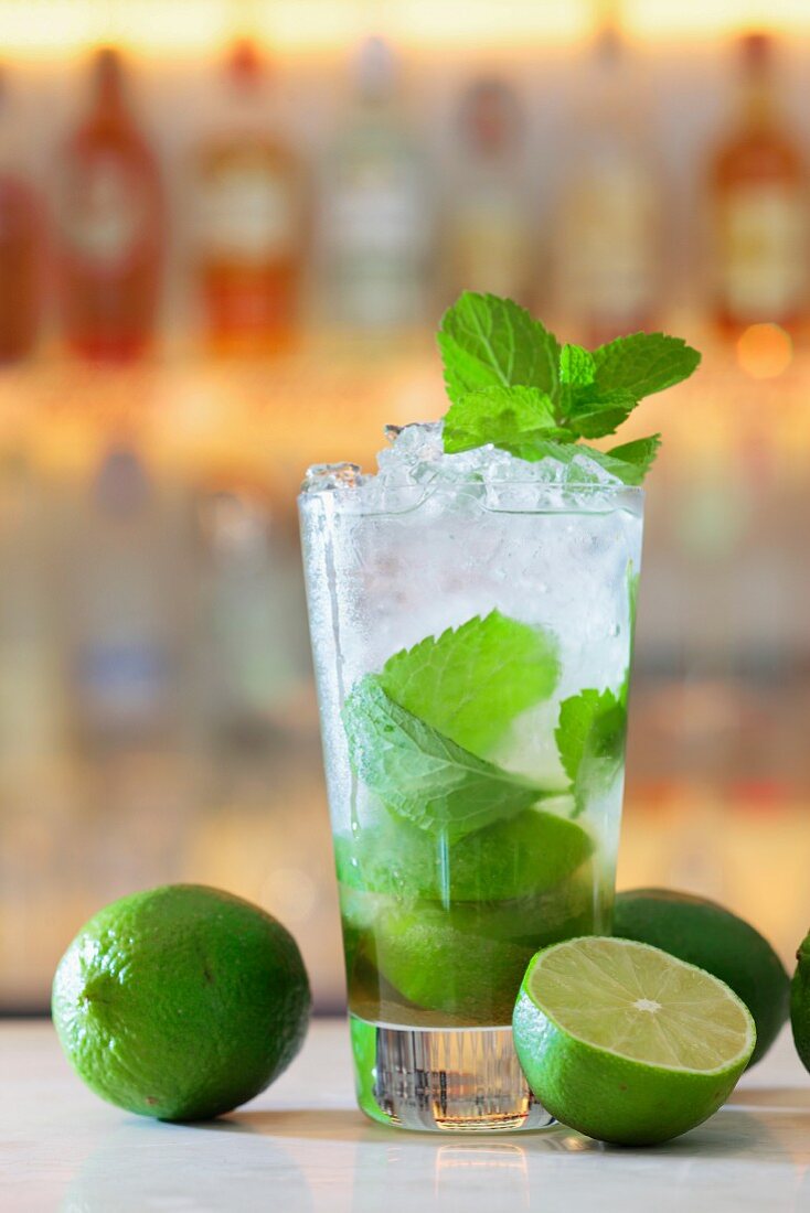 A Mojito with mint and lime in a bar