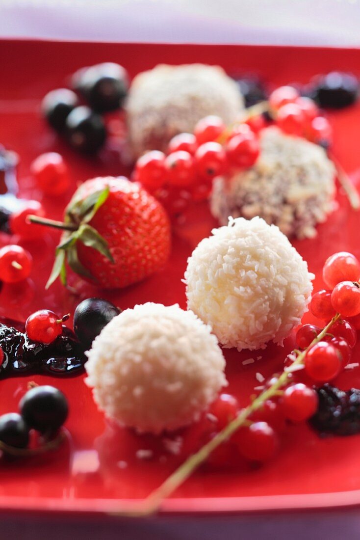 White chocolate and coconut pralines with fresh berries