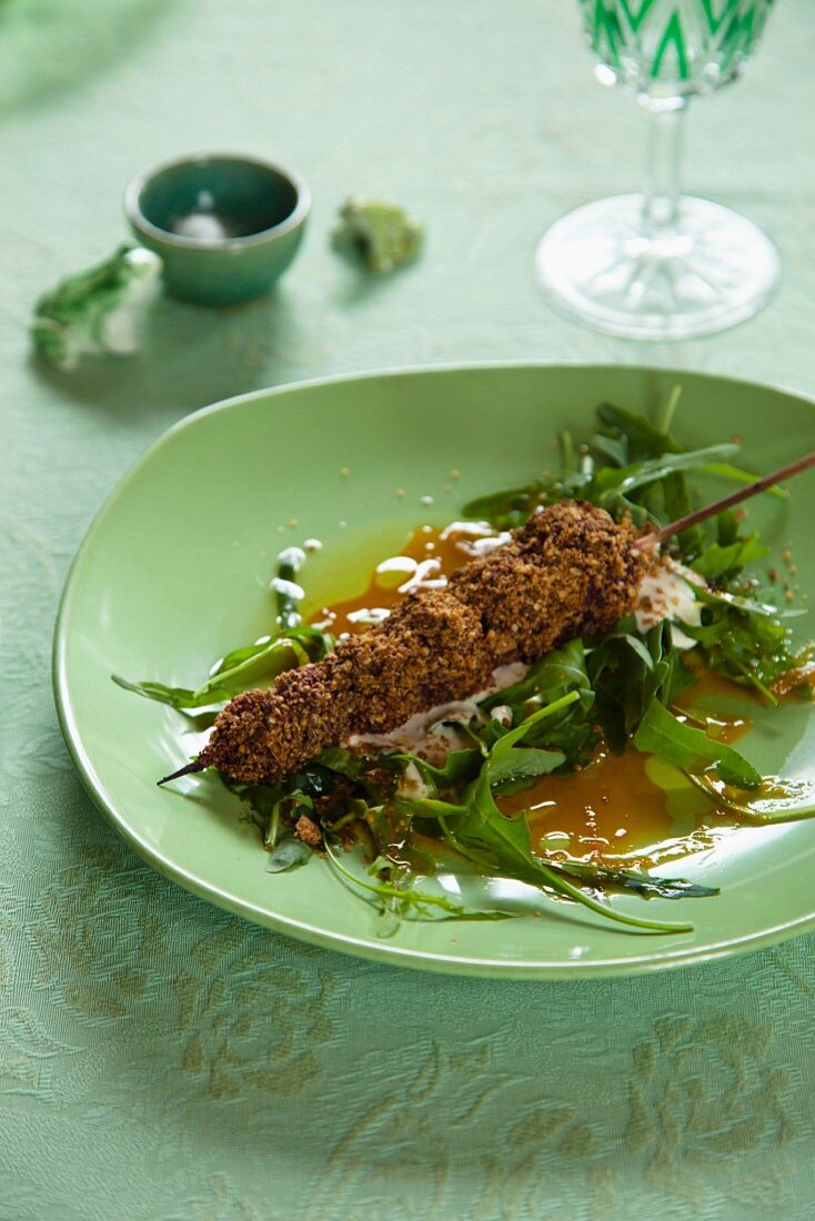 Beetroot skewers with a dukkah crust on a rocket salad