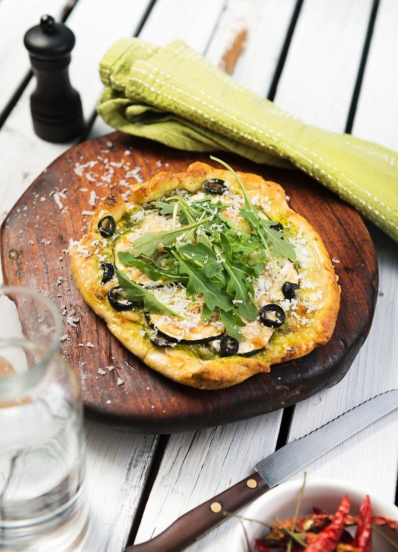 Vegetable pizza with cheese and rocket