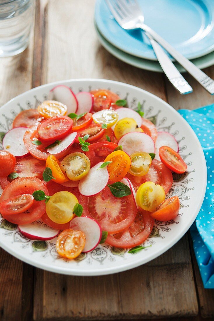 A colourful tomato salad with radishes
