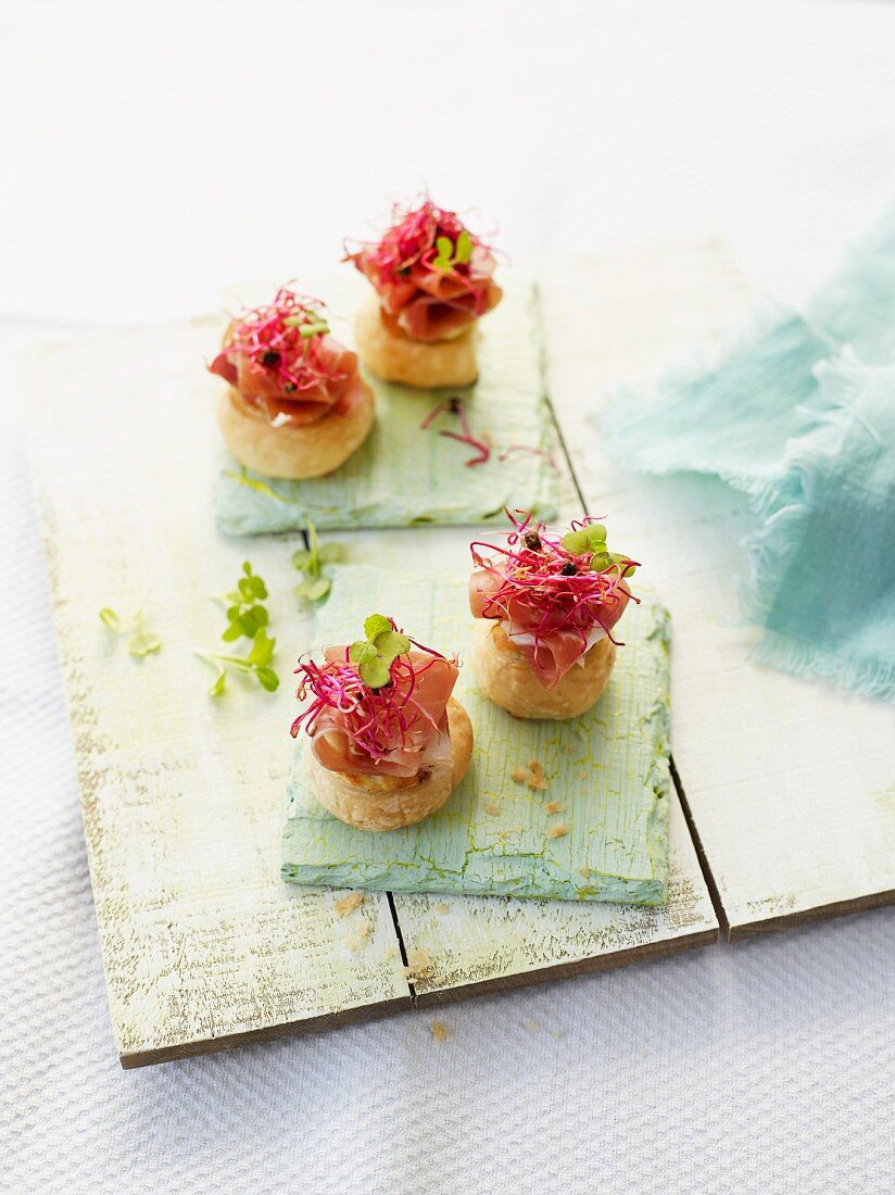 Puff pastry rolls with Serrano ham and beetroot shoots