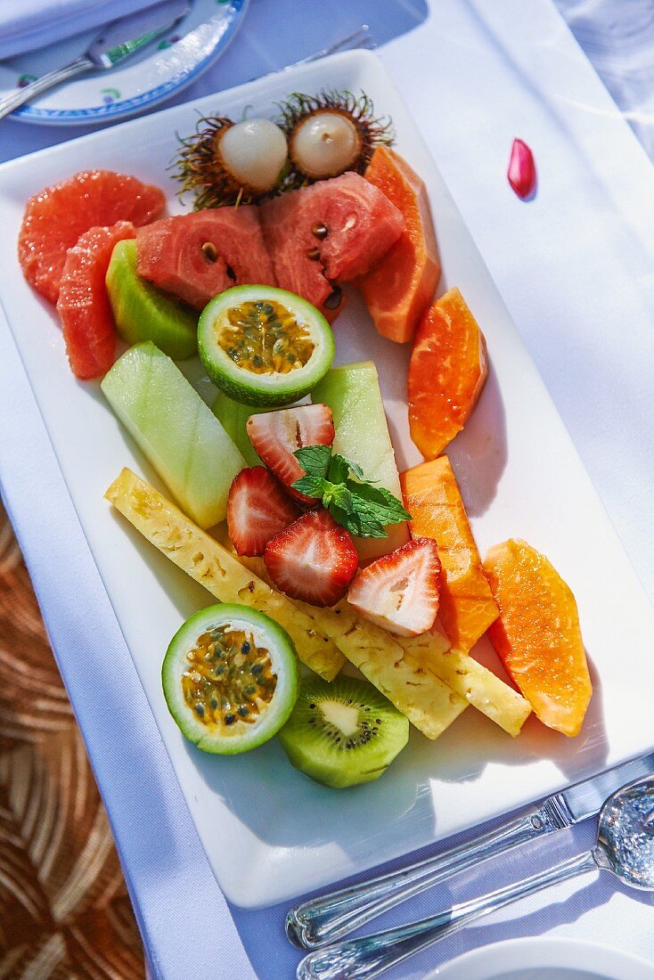 A platter of fresh fruits outside