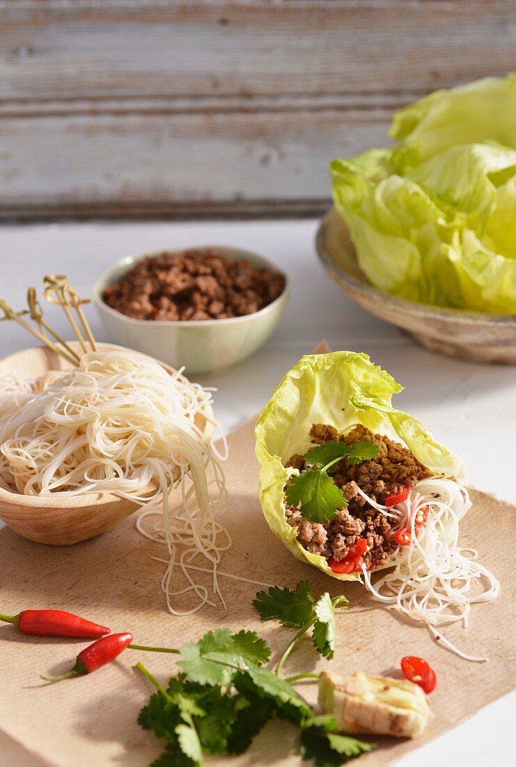 Rice noodles with minced meat in a lettuce leaf