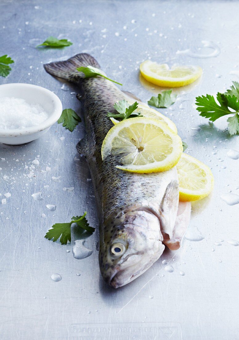 A fresh trout with lemon slices