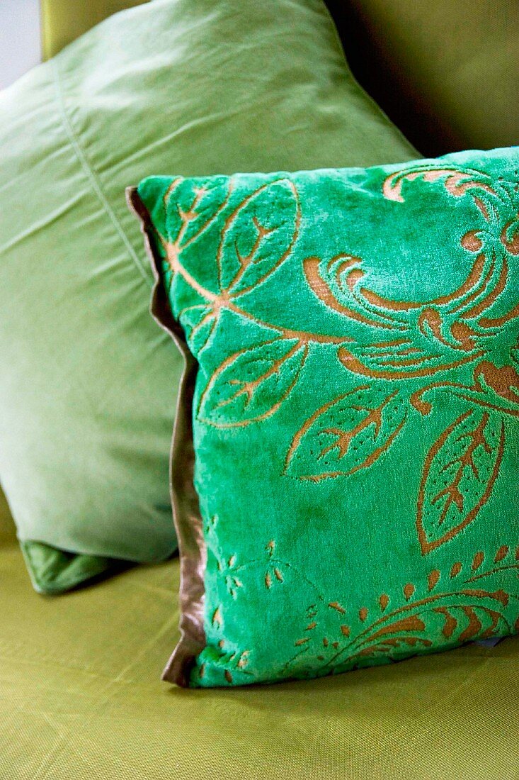 Green scatter cushion with devoré pattern