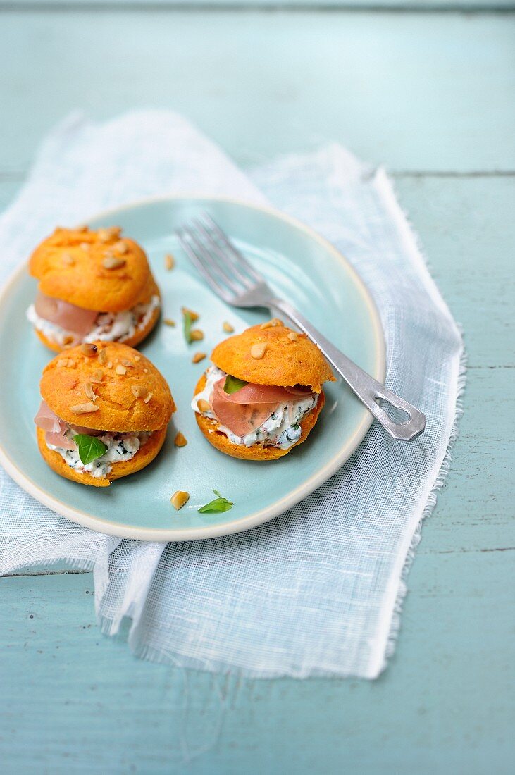 Tomato gougeres filled with ricotta cream and ham