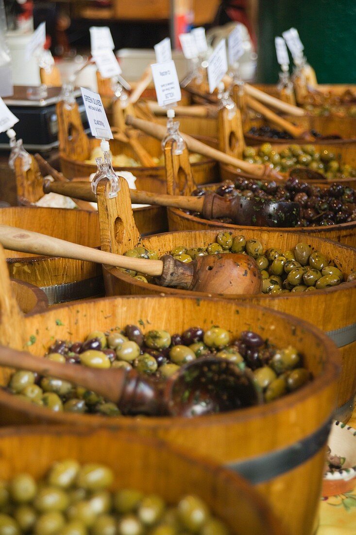 Wooden barrels of preserved olives at a market in London