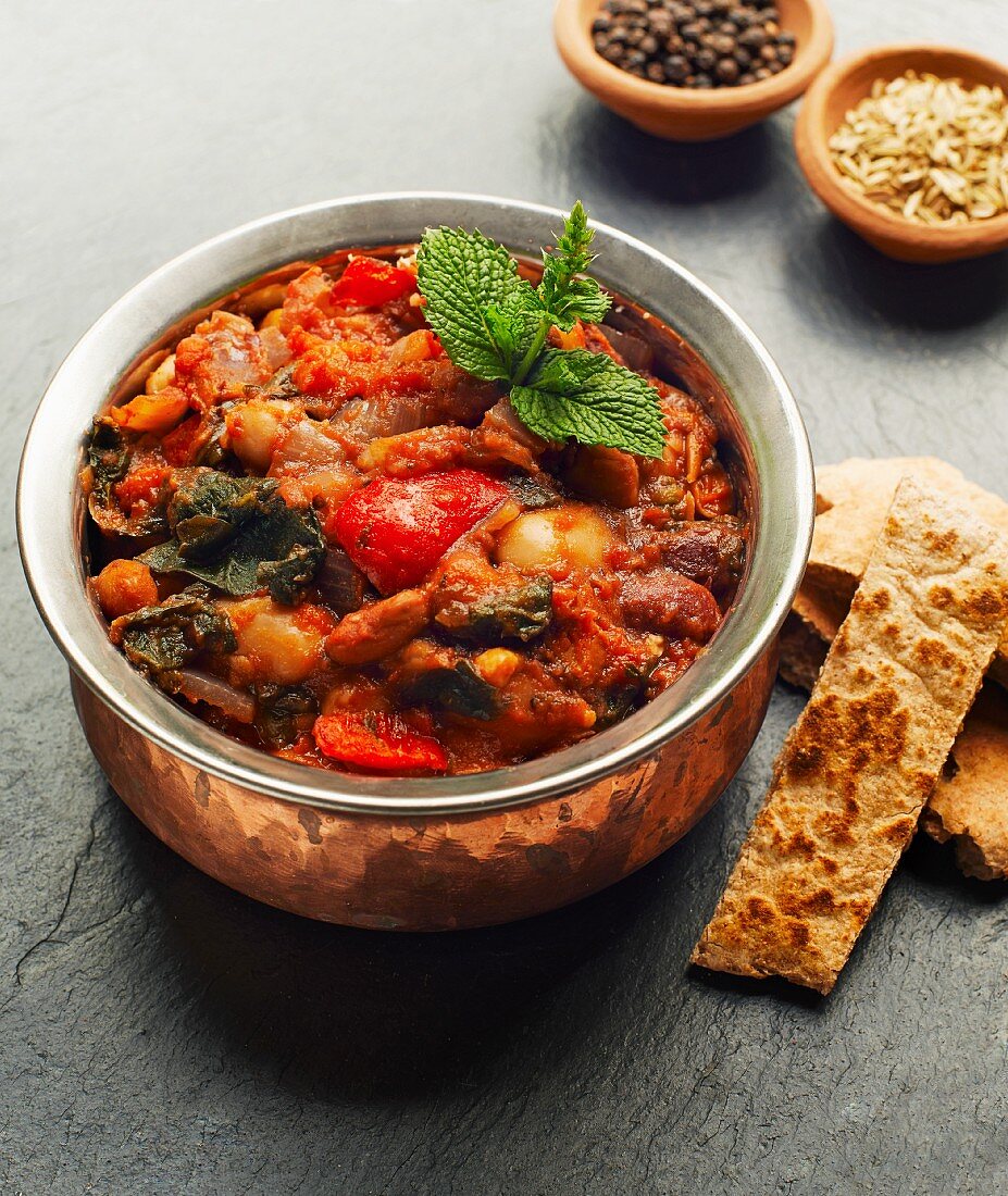 A casserole made with beans, peppers and spinach