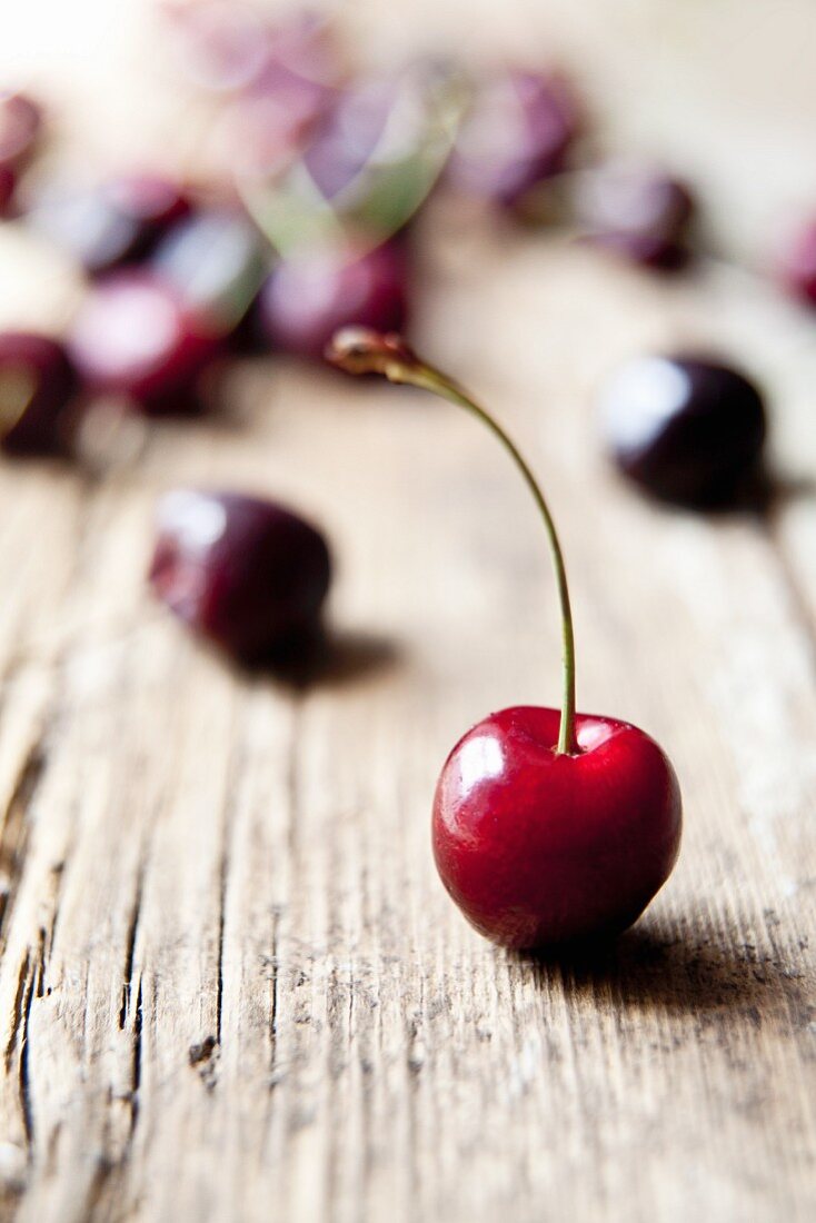 Cherries on a rustic wooden table