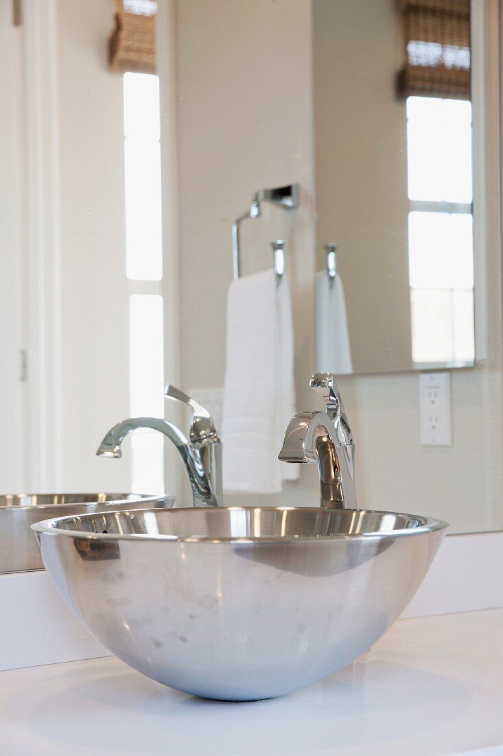 Close-up of stainless steel sink in bathroom; Irvine; California; USA