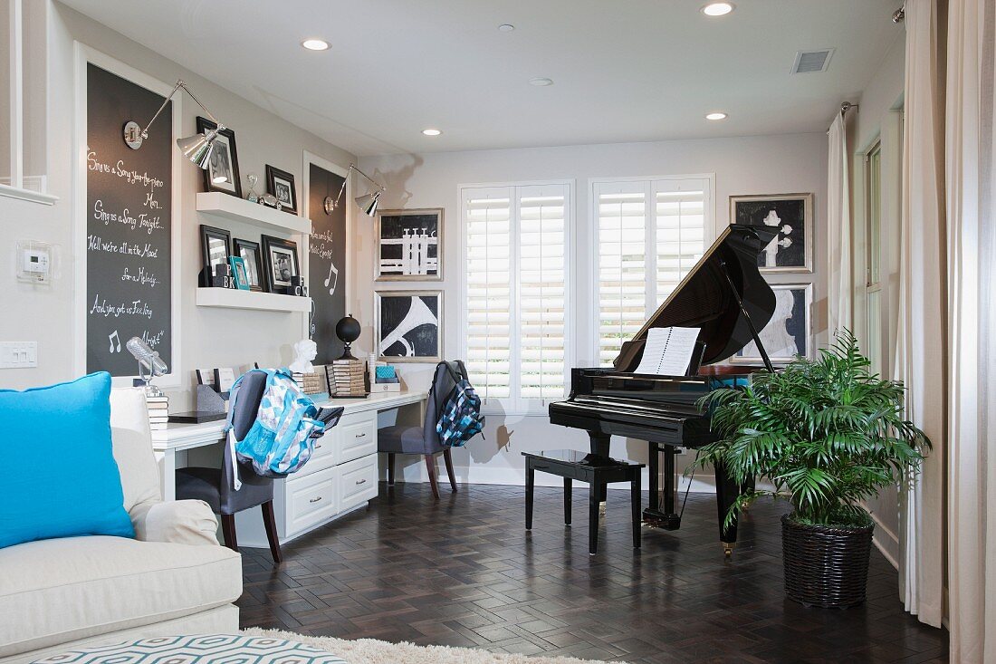 Living room with study area and piano; Irvine; California; USA