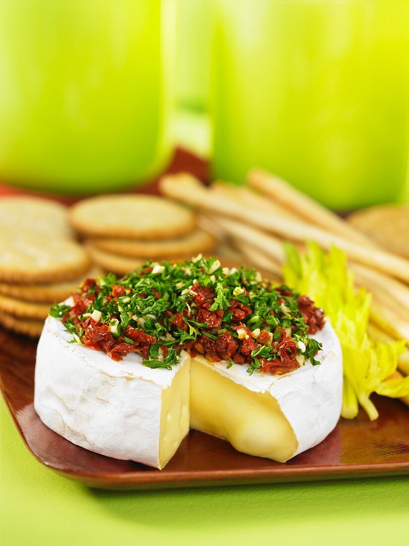 Sliced brie topped with chopped, dried tomatoes