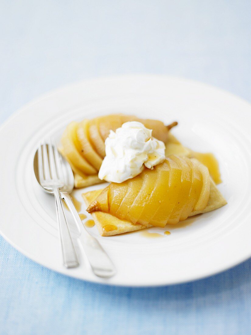 Pear tartlets topped with whipped cream