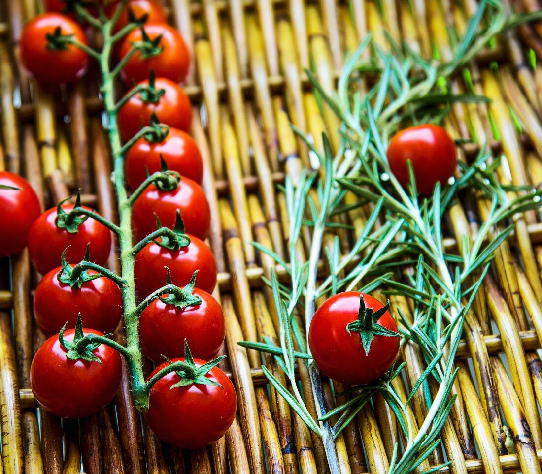 Cherry tomatoes and rosemary on a basket