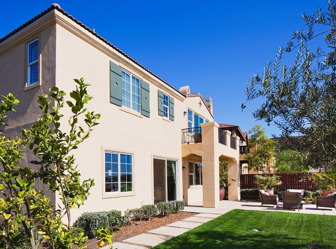 Exterior of two story house with lawn; San Marcos; California; USA