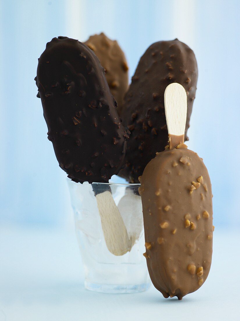 Chocolate-covered ice cream sticks with milk and dark chocolate