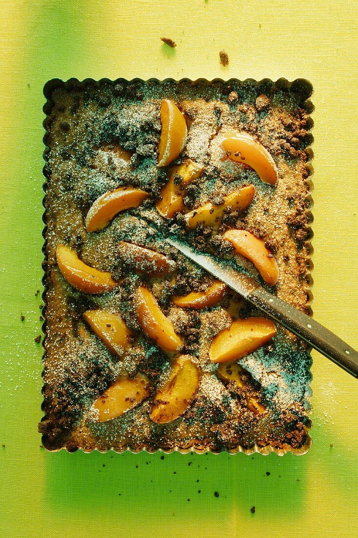 Chocolate crumble cake with peaches