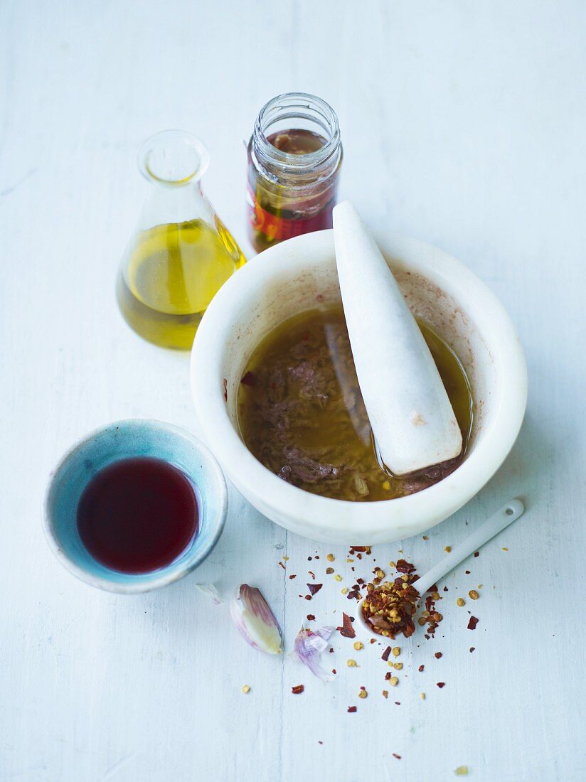 Salad dressing made with chilli, anchovies, garlic and olive oil