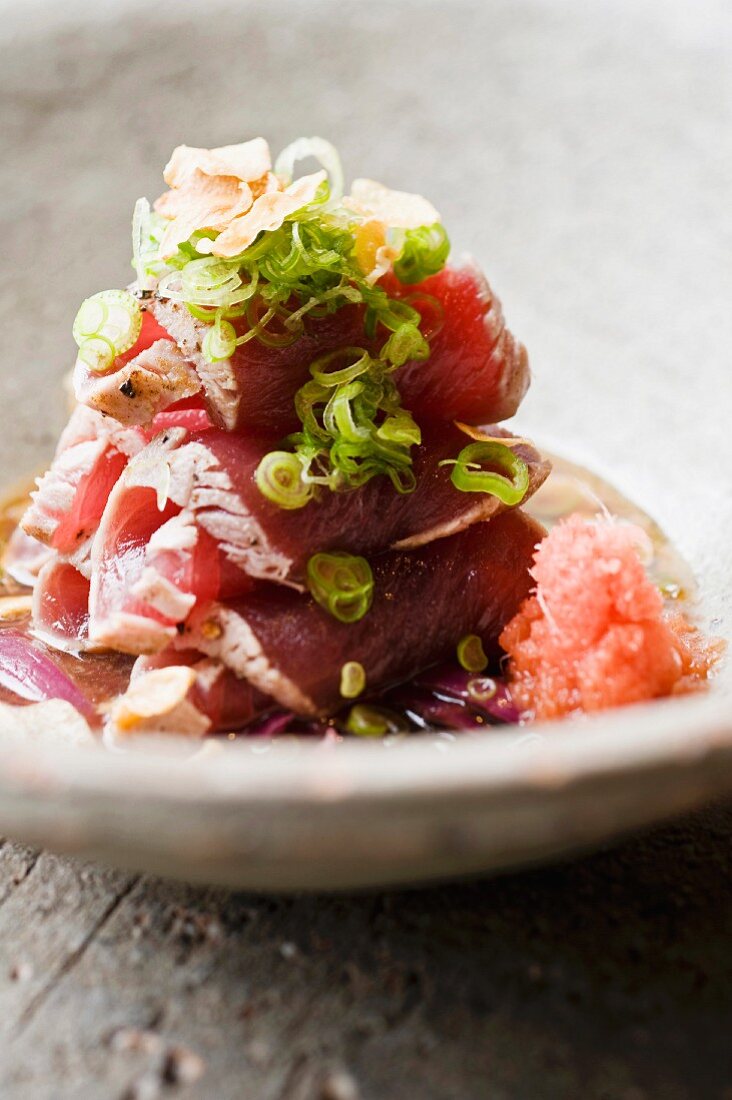 Flash fried tuna with chilli daikon and poncho source