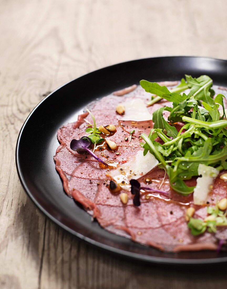 Beef carpaccio with rocket and Parmesan