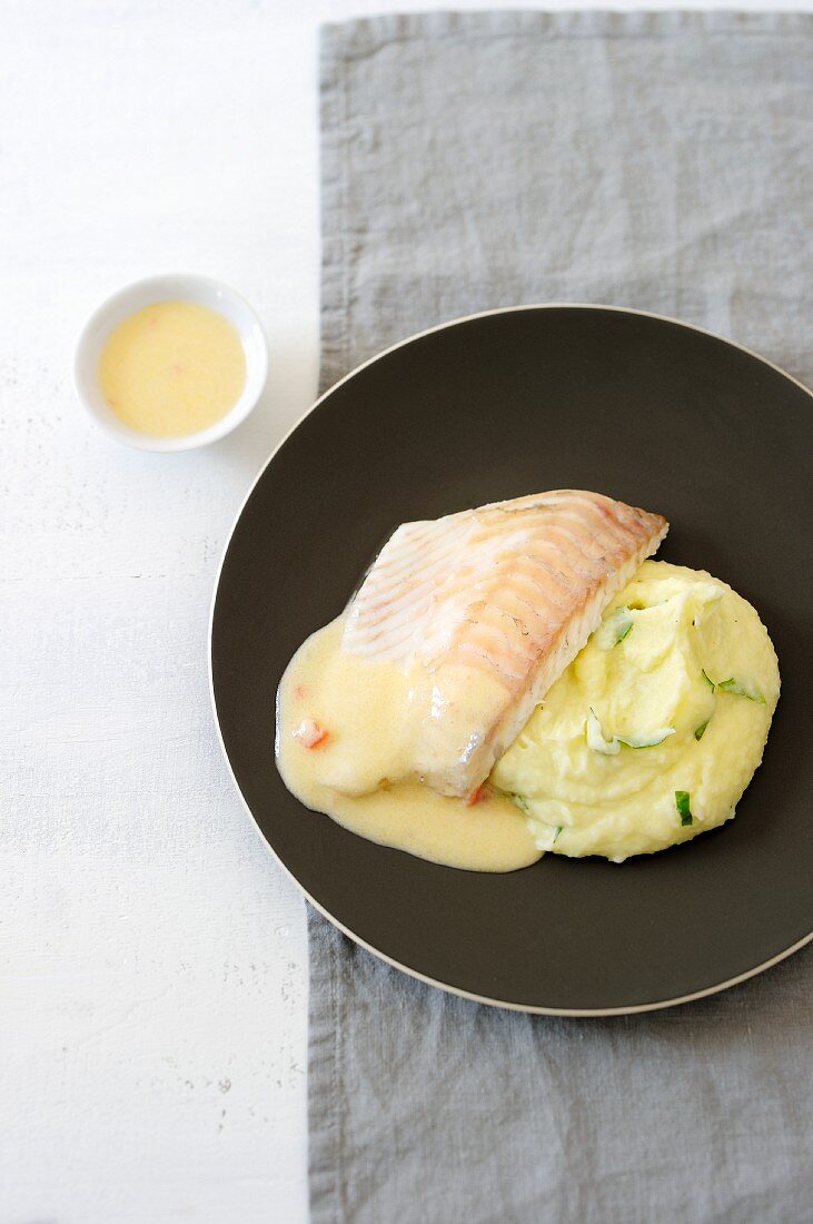 Poached turbot with fish sauce and mashed potatoes