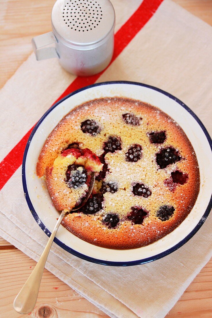 Blackberry clafoutis with icing sugar