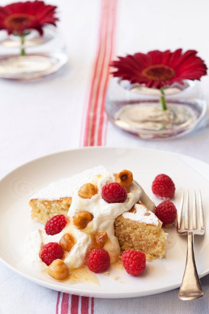 Hazelnut cake with vanilla cream and raspberries