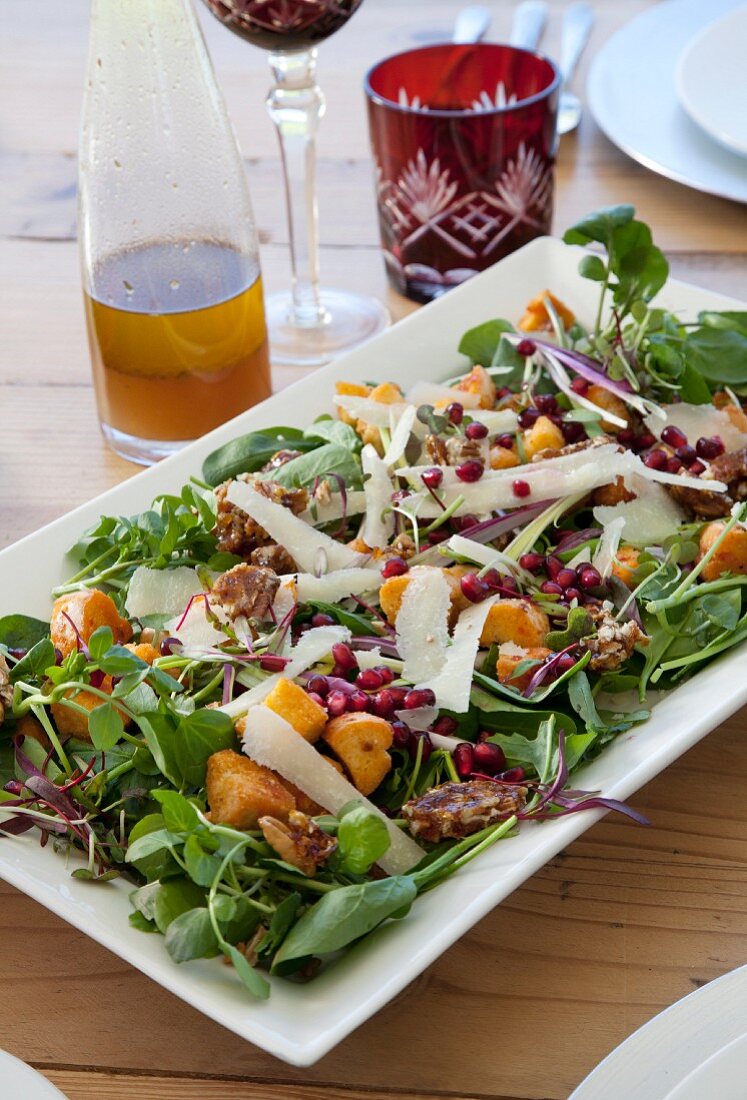 A mixed leaf salad with chilli and walnut caramel, rocket and watercress