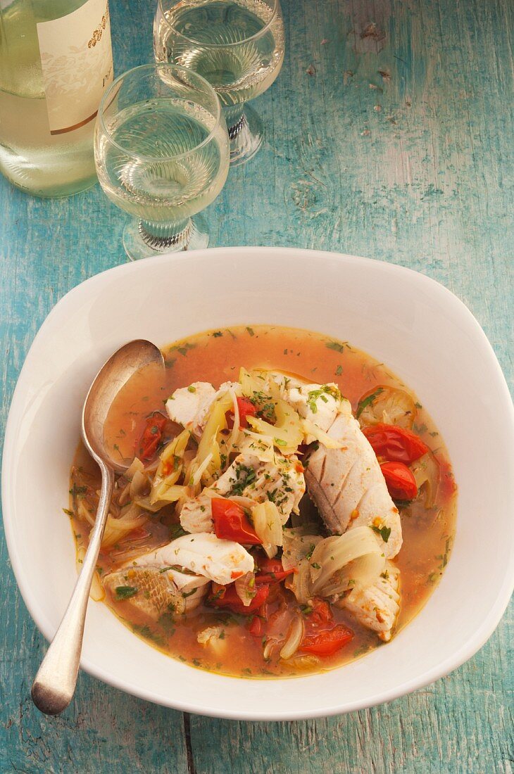 Fish stew with tomatoes and herbs
