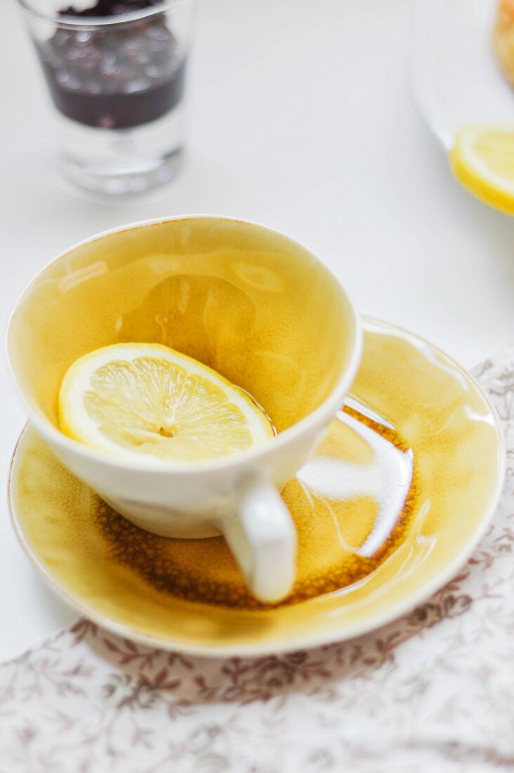 A slice of lemon in a teacup