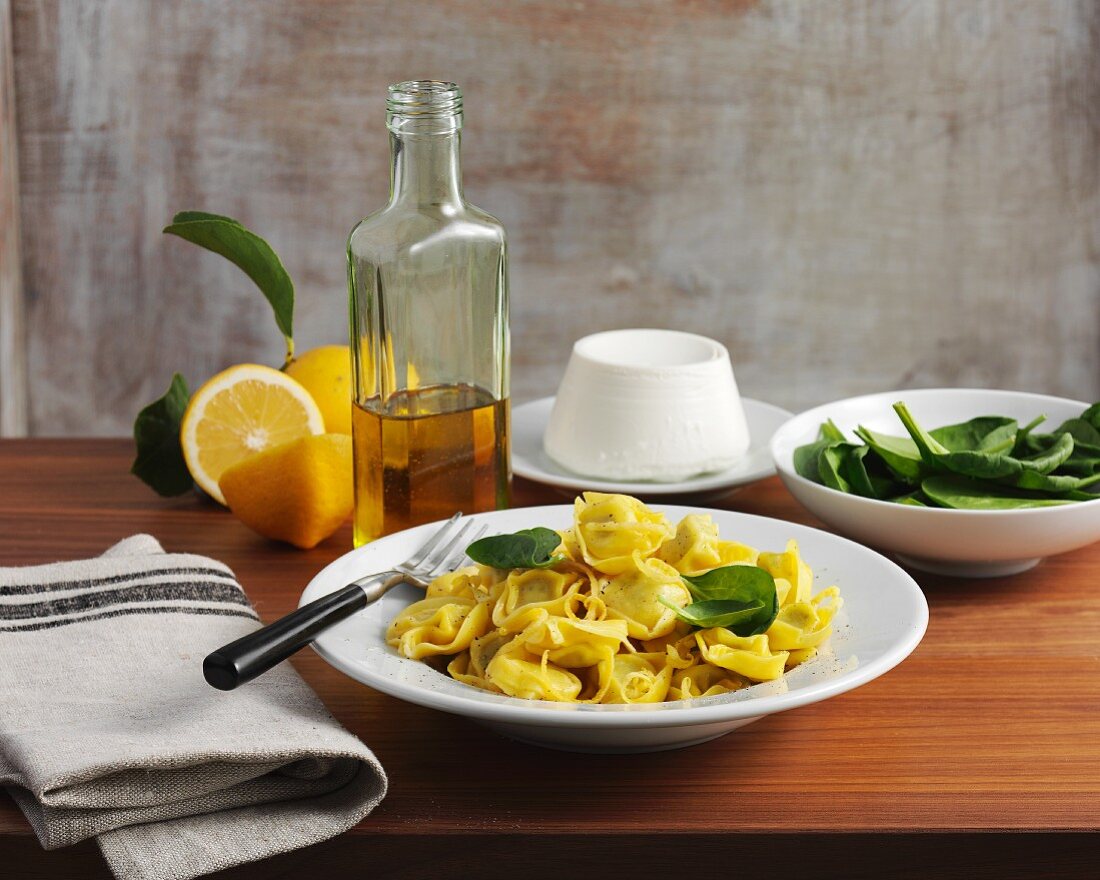 Tortellini with lemons, rocket and spinach