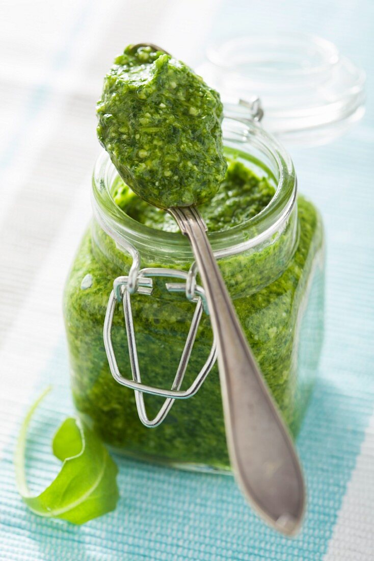 Rocket pesto in a jar and on a spoon