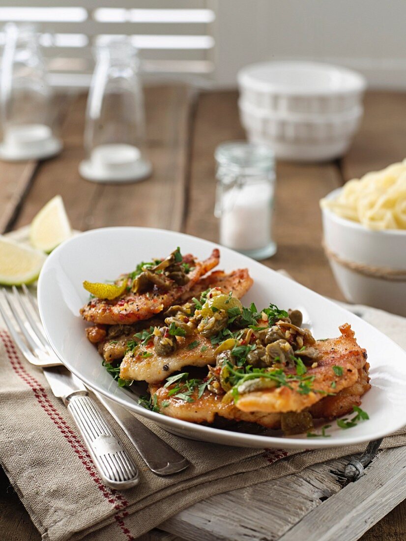 Chicken escalope with lemon and capers