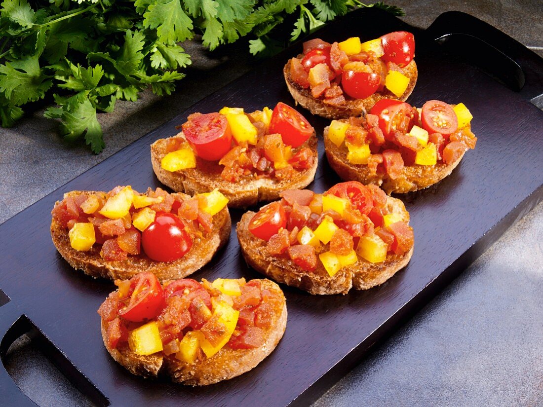 Bruschetta with grape tomatoes, yellow peppers and salsa