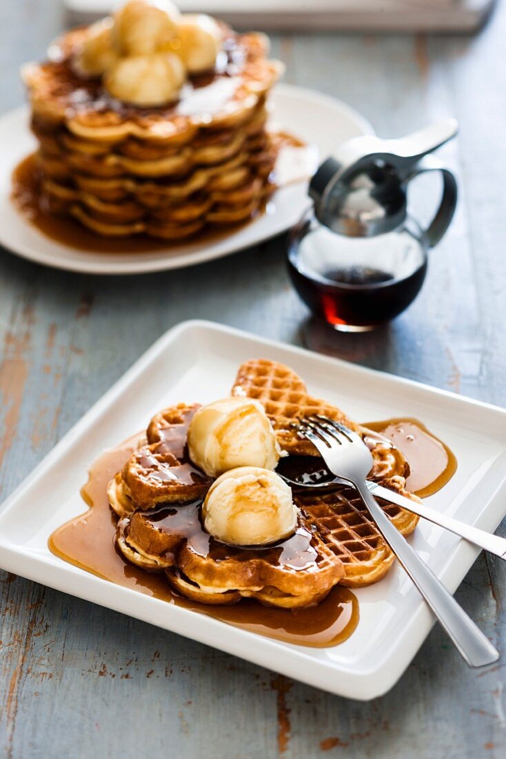 Waffles with vanilla ice cream and maple syrup