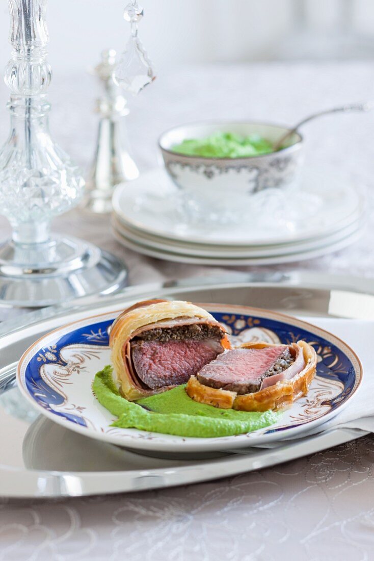 Beef Wellington on a bed of mushy peas and mashed potato