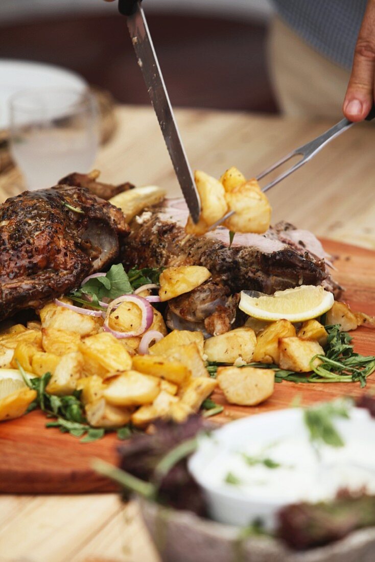 Roasted led of lamb being carved