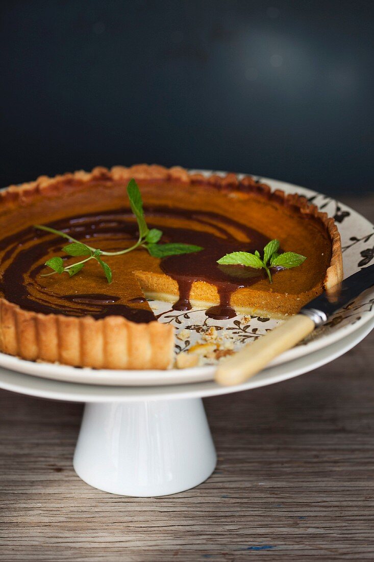 Pumpkin pie with chocolate sauce