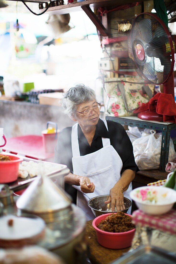 A street kitchen at a market in Bangkok (Thailand)