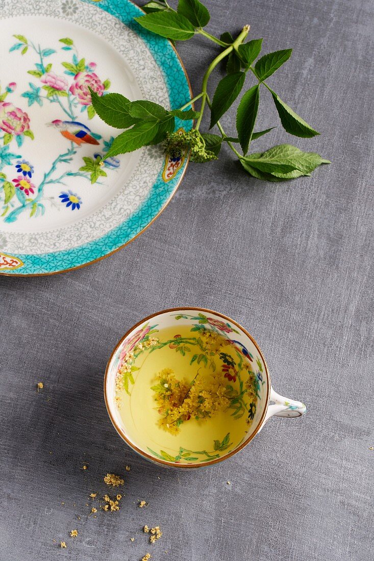 Elderflower tea in a floral-patterned cup