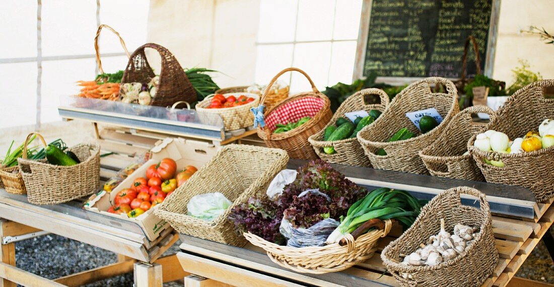Baskets of vegetables on a market stall