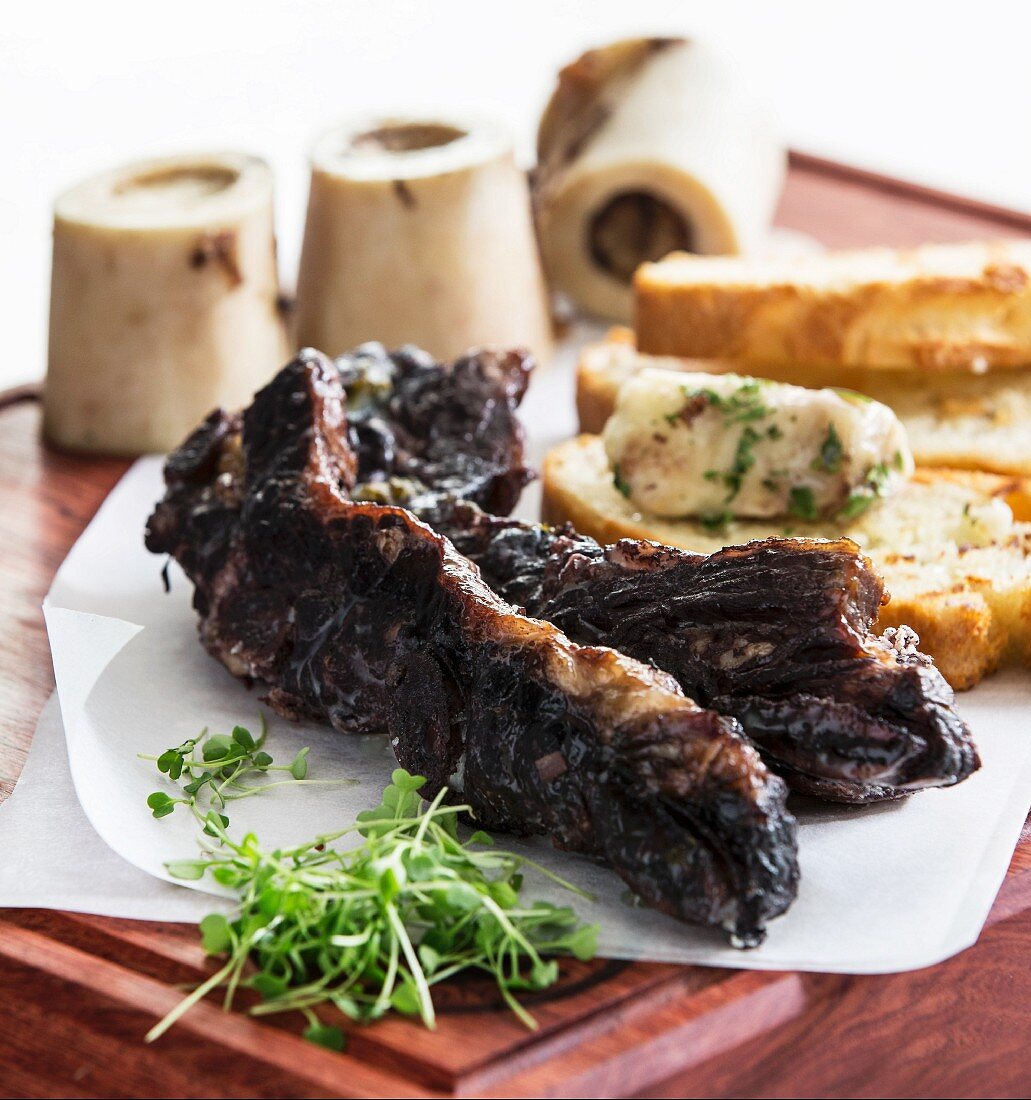 Beef ribs brazen red wine with beef marrow bones and parsley